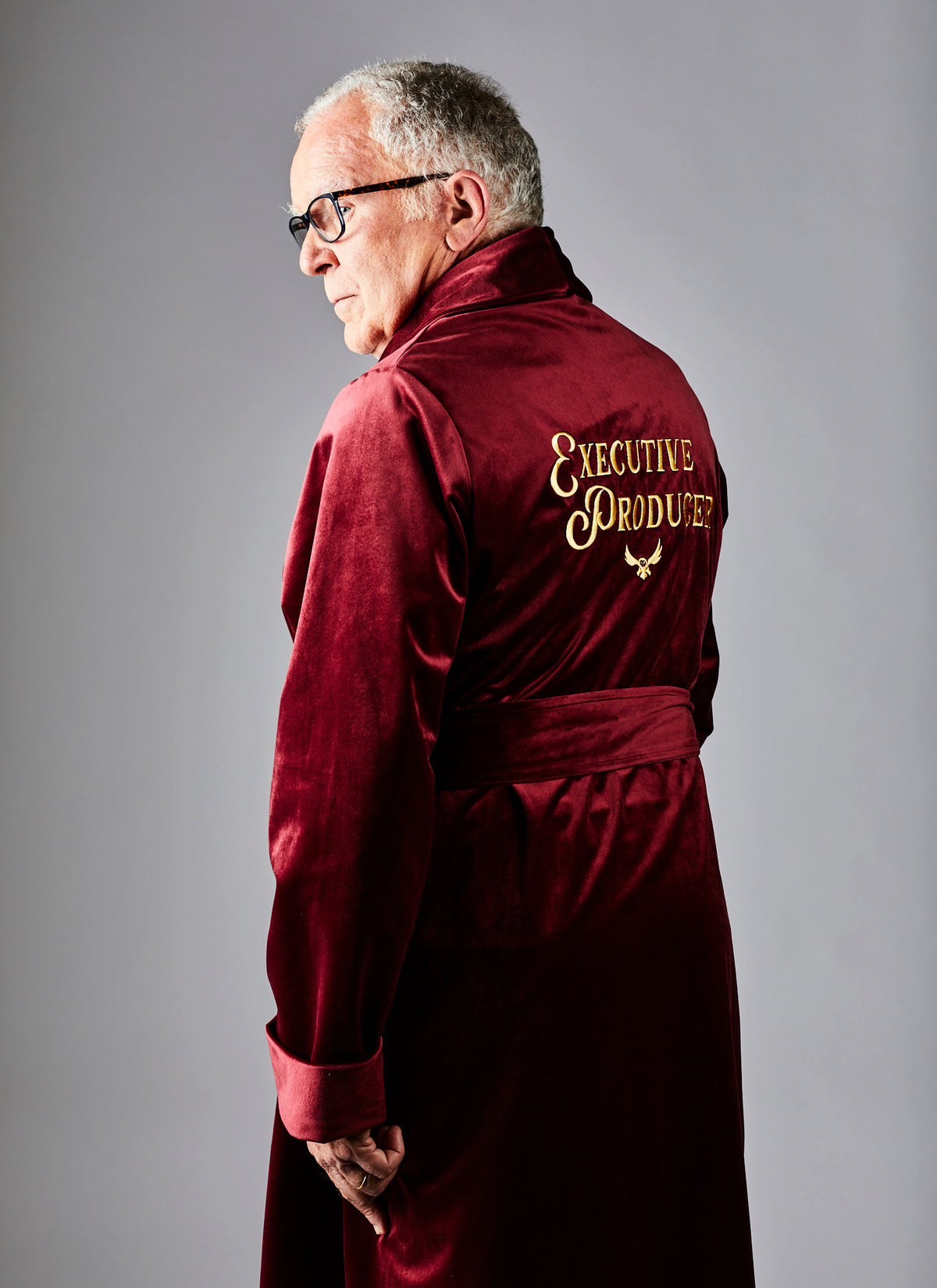 Side angle of a male wearing a luxurious red silk robe from Enamoured Iris